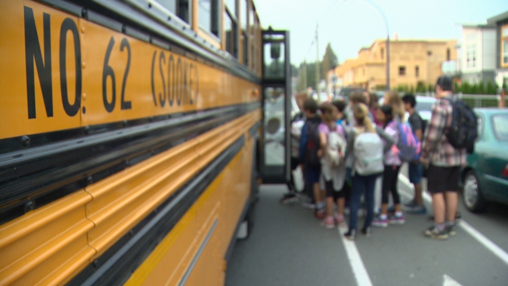 A Sooke School District bus is shown picking up students in an undated photo. (CTV News)