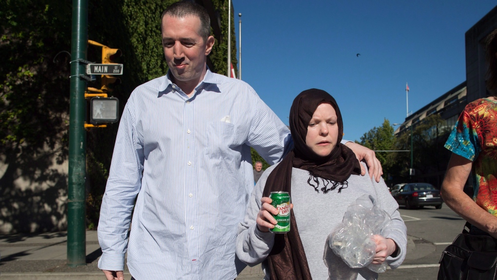 John Nuttall, left, and Amanda Korody leave jail after being re-arrested and placed under a peace bond and released again, after a judge ruled the couple were entrapped by the RCMP in a police-manufactured crime. July 29, 2016. (The Canadian Press/Darryl Dyck