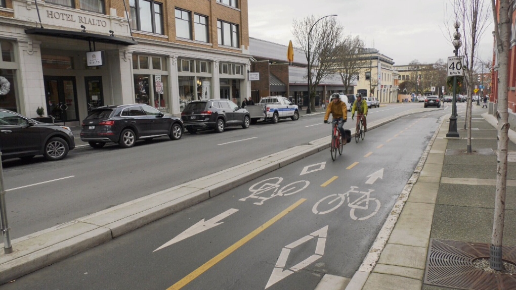 Riders use a protected bike lane on Pandora Avenue: Dec. 16, 2019 (CTV News)