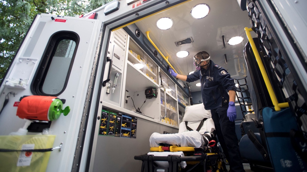 B.C. Ambulance paramedic Jeff Booton cleans his ambulance at station 233 in Lions Bay, B.C. on Wednesday, April 22, 2020. THE CANADIAN PRESS/Jonathan Hayward