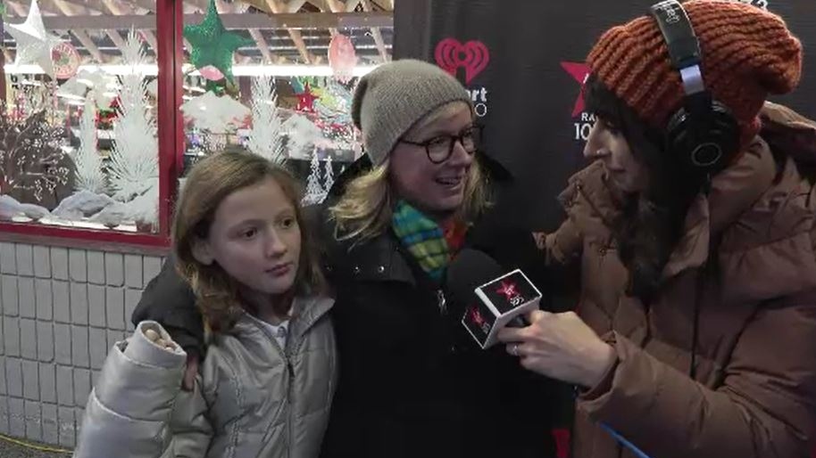 Rhianna Bray, centre, with her daughter Sadie Siegel, left, and radio host Bailey Parker at the prize draw in Victoria on Dec. 2, 2022. (CTV News)