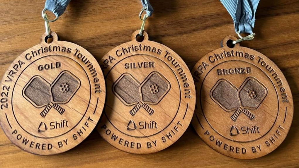 The tournament medals, made from wood grown on Vancouver Island, are shown. (CTV News)