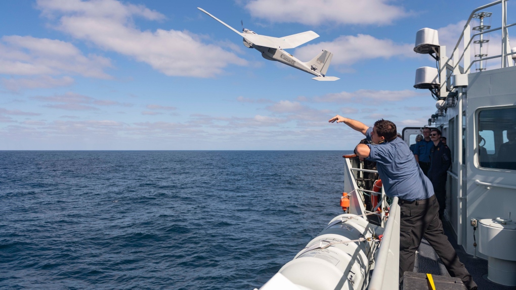 A Royal Canadian Navy member aboard HMCS Yellowknife launches an aerial surveillance drone during Operation Caribbe on Feb. 24, 2022. (Canadian Armed Forces)