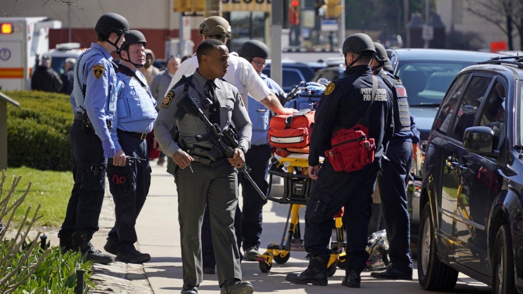 Pittsburgh police and paramedics respond to Pittsburgh Central Catholic High School for what turned out to be a hoax report of an active shooter, on Wednesday, March 29, 2023 in the Oakland neighborhood of Pittsburgh. (AP Photo/Gene J. Puskar)