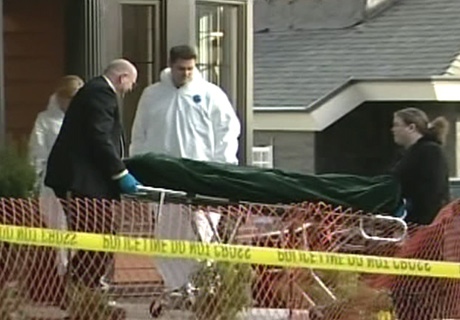 Officials remove the body of Lindsay Buziak from a home in Saanich, B.C., on Monday, Feb. 4, 2008.